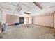 Unfinished basement with concrete floor and block walls awaiting your design ideas at 1211 N Boyce St, Gastonia, NC 28052