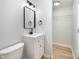 The bathroom features new floors, fixtures and a convenient closet for storage at 1211 N Boyce St, Gastonia, NC 28052