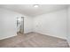 Bright bedroom with new carpet, ensuite bathroom, and ample closet space at 1211 N Boyce St, Gastonia, NC 28052