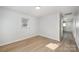 Light-filled bedroom with modern laminate flooring and neutral color palette at 1211 N Boyce St, Gastonia, NC 28052