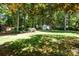 Expansive backyard with mature trees, green lawn, and storage shed at 1261 Hawthorne Dr, Indian Trail, NC 28079