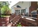 Backyard featuring a spacious deck, seating, and landscaped flowerbeds at 1261 Hawthorne Dr, Indian Trail, NC 28079