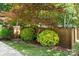 Fenced backyard with manicured landscaping and mature trees, creating a private retreat at 1261 Hawthorne Dr, Indian Trail, NC 28079