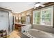 Bright bathroom featuring a soaking tub, walk-in shower, and double vanity at 1261 Hawthorne Dr, Indian Trail, NC 28079