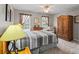 Bedroom with natural light, ceiling fan, carpet, and wooden wardrobe at 1261 Hawthorne Dr, Indian Trail, NC 28079