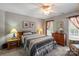 Bedroom with natural light, ceiling fan, carpet, and picture frame decorations at 1261 Hawthorne Dr, Indian Trail, NC 28079