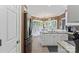 Bright kitchen with eat-in breakfast nook, white cabinets, stainless steel appliances, and granite counters at 1261 Hawthorne Dr, Indian Trail, NC 28079