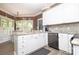 Well-lit kitchen with granite countertops, stainless steel appliances and white cabinets at 1261 Hawthorne Dr, Indian Trail, NC 28079