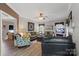 Inviting living room with wood floors, comfortable sofas, and a decorative fireplace at 1261 Hawthorne Dr, Indian Trail, NC 28079