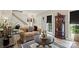 Cozy living room featuring stylish furniture, wood floors, and ample natural light at 1261 Hawthorne Dr, Indian Trail, NC 28079
