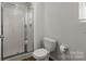 Clean bathroom featuring a glass-enclosed shower and standard toilet at 1270 Winding Creek Rd, Salisbury, NC 28146