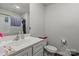 Bright bathroom with a white vanity, sink, and standard toilet at 1270 Winding Creek Rd, Salisbury, NC 28146