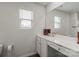 Well-lit bathroom featuring a long countertop, cabinets, and a large mirror at 1270 Winding Creek Rd, Salisbury, NC 28146