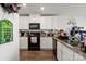 Bright kitchen with white cabinetry, granite countertops, and contemporary appliances at 1270 Winding Creek Rd, Salisbury, NC 28146