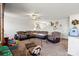 Inviting living room with a comfortable sectional sofa and ceiling fan, creating a relaxed atmosphere for gatherings at 1270 Winding Creek Rd, Salisbury, NC 28146