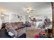 Spacious living room with a comfortable sectional sofa, ceiling fan, and open layout to the kitchen at 1270 Winding Creek Rd, Salisbury, NC 28146