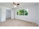 Bedroom with carpet, closet, and window at 1411 Caldwell St, Gastonia, NC 28052