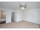 Bedroom featuring carpet, closet, ceiling fan and attached bathroom at 1411 Caldwell St, Gastonia, NC 28052
