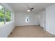Bedroom with carpet, windows, and a ceiling fan at 1411 Caldwell St, Gastonia, NC 28052