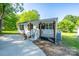 Lovely single-story home featuring a covered porch with wooden columns and a curved driveway at 1411 Caldwell St, Gastonia, NC 28052
