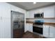 Bright kitchen with white cabinets, butcher block countertops, and stainless steel appliances at 1411 Caldwell St, Gastonia, NC 28052