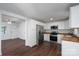 Modern kitchen featuring white cabinets, butcher block countertops, and stainless steel appliances at 1411 Caldwell St, Gastonia, NC 28052