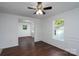 Open-concept living room with beautiful flooring and a view into an adjacent room at 1411 Caldwell St, Gastonia, NC 28052