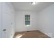 Room with carpet, window, and door at 1411 Caldwell St, Gastonia, NC 28052