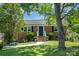 Charming brick home with a well-manicured front yard and mature trees at 145 Driftwood Dr, Mooresville, NC 28117