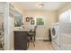 Laundry room with breakfast bar and modern appliances at 145 Driftwood Dr, Mooresville, NC 28117