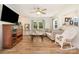 Cozy living room with a large window, ceiling fan, and comfortable seating at 145 Driftwood Dr, Mooresville, NC 28117