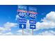 Interstate 485 highway signs under bright blue skies, indicating directions for outer and inner loops at 1650 Respect Nw St, Concord, NC 28027
