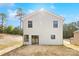 Backyard view of the home showcasing the light siding and window features at 1837 Bear St, Charlotte, NC 28214