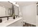 Elegant bathroom with dual sinks, modern fixtures, and a glass-enclosed shower at 1837 Bear St, Charlotte, NC 28214