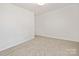 Spacious bedroom featuring neutral carpeting, recessed lights, and ample natural light at 1837 Bear St, Charlotte, NC 28214