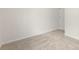 Bedroom showcasing neutral carpeting, and an off-white painted wall at 1837 Bear St, Charlotte, NC 28214