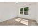 Bright bedroom with neutral carpeting, and a window offering ample sunlight at 1837 Bear St, Charlotte, NC 28214
