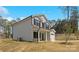 Side view of a two-story home showcasing gray siding and well-maintained landscaping at 1837 Bear St, Charlotte, NC 28214