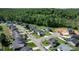 Aerial view of a well-planned neighborhood with tree-lined streets, green lawns, and diverse home styles at 1925 Maius Dr # 30, Conover, NC 28613