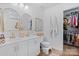 Bright bathroom featuring double sinks, gold-tone fixtures, and a separate toilet area at 1925 Maius Dr # 30, Conover, NC 28613