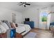 Bright bedroom with a blue dresser, wood floors, and large window at 1925 Maius Dr # 30, Conover, NC 28613