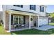 Charming front porch with seating, complemented by a pink door adorned with a wreath and decorative plants at 1925 Maius Dr # 30, Conover, NC 28613