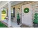 Inviting front porch with decorative plants, a welcoming mat, and a stylish front door at 1925 Maius Dr # 30, Conover, NC 28613