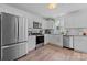 Modern white kitchen with stainless steel appliances, granite countertops, and ample cabinet space at 1925 Maius Dr # 30, Conover, NC 28613