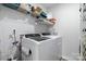 Well-organized laundry room featuring modern washer and dryer units and overhead shelving at 1925 Maius Dr # 30, Conover, NC 28613