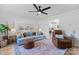 Cozy living room with neutral walls, hardwood floors, and open access to the kitchen at 1925 Maius Dr # 30, Conover, NC 28613