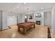 Basement featuring a billiards table and a fireplace with a TV above it at 1929 Faison Ave, Fort Mill, SC 29708