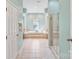 Bright bathroom with walk-in shower, soaking tub, and tiled floors at 1929 Faison Ave, Fort Mill, SC 29708