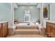 Large soaking tub with tile surround and natural light at 1929 Faison Ave, Fort Mill, SC 29708
