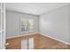 Bright bedroom features hardwood floors and shuttered windows for a cozy, light-filled space at 1929 Faison Ave, Fort Mill, SC 29708